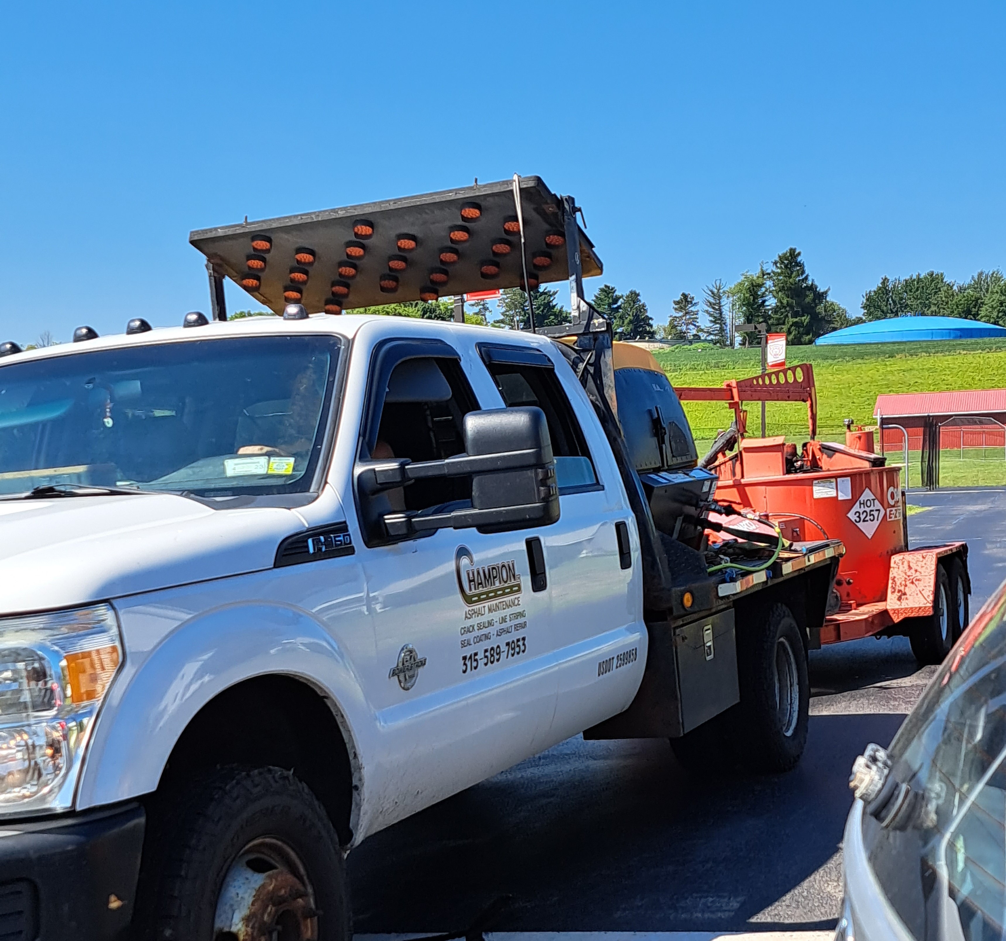 Crack sealant truck applying hot pour sealant
